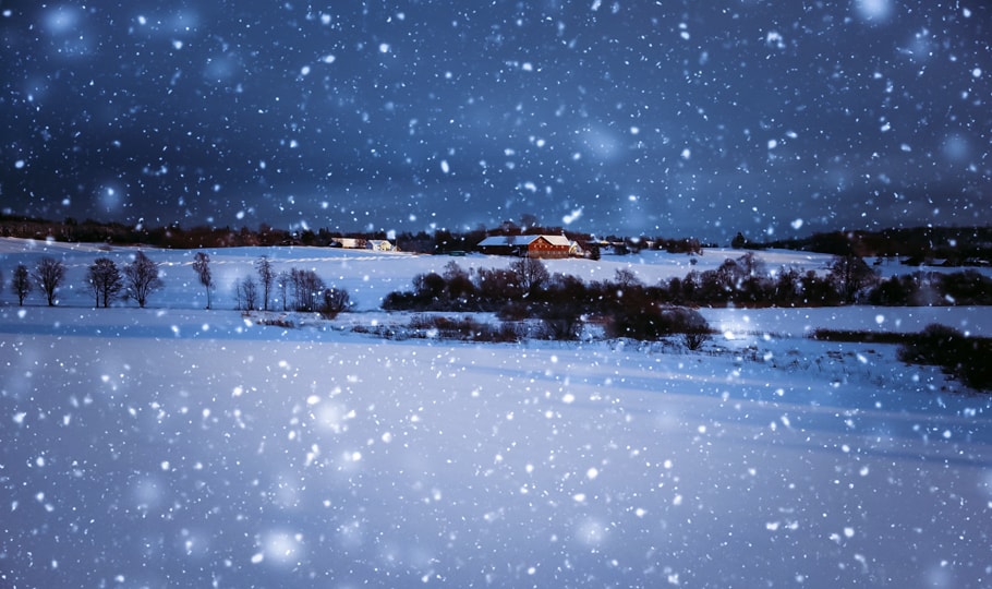 Falling snow in front of cabin wallpapers